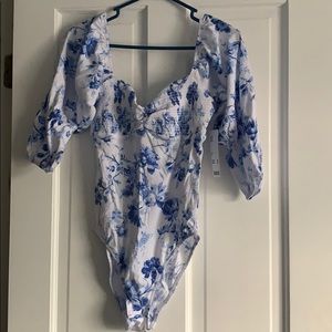 Shoulder cap body suit